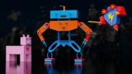 Left to right: a four-legged, pink robot with a red heart on its chest and tiny ears; a tall, wide orange and blue robot with wire hands; a flying triangular robot with a lightning bolt on its chest