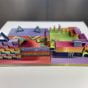 A front-view photograph of The Gate of Success, four interlocking pieces of colorful 3-d printed structures