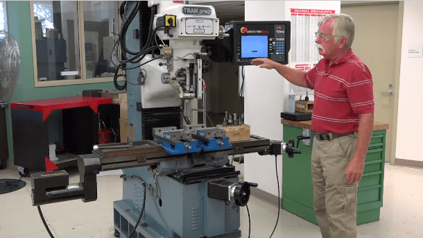 image of Professor Peter Rourke in front of the Vertical Milling Machine