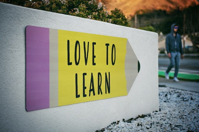 Pencil with 'love to learn' written on it by tim-mossholder-WE_Kv_ZB1l0-unsplash